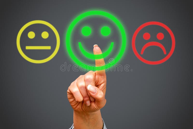Finger of person pressing positive feedback smiling face on interactive display screen. Finger of person pressing positive feedback smiling face on interactive display screen.