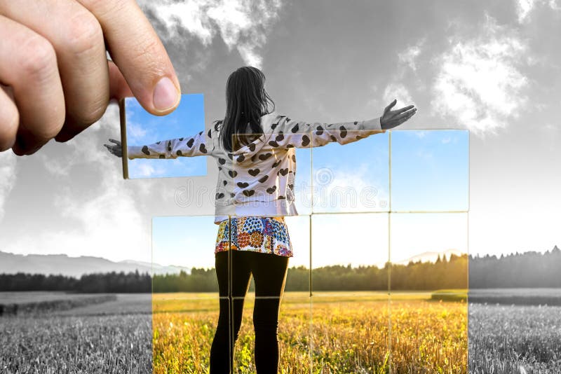 Young woman standing on field with hands wide open. Concept of positive personal perspective toward life. Young woman standing on field with hands wide open. Concept of positive personal perspective toward life.