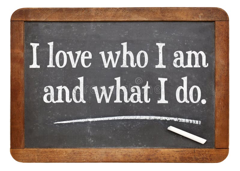 I love who I am and what I do - positive affirmation words on a vintage slate blackboard. I love who I am and what I do - positive affirmation words on a vintage slate blackboard