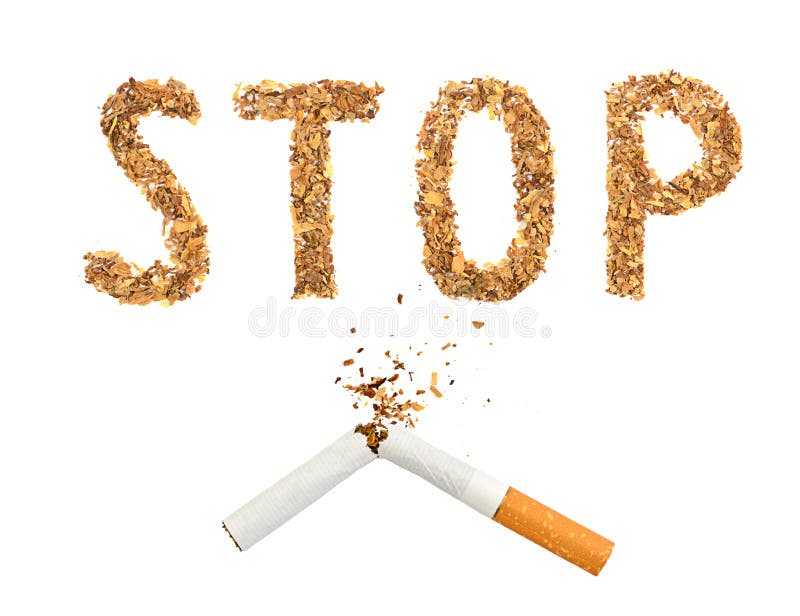 破碎的香烟和用烟草制成的“停止”字 免版税库存照片