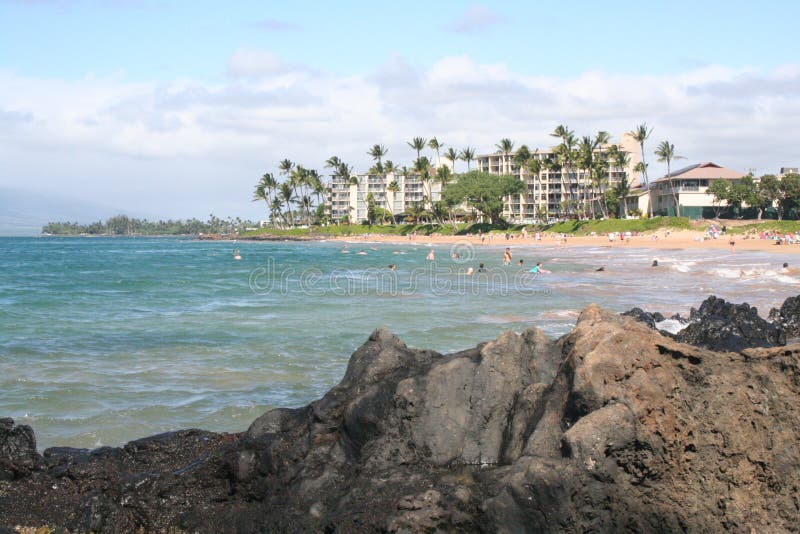 Maui Beach scene with people taking pictures. Maui Beach scene with people taking pictures.