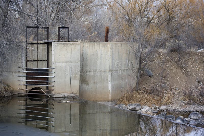 Diversion dam and inlet to irrigation ditch, Cache la Poudre River in Colorado, very low water in winter. Diversion dam and inlet to irrigation ditch, Cache la Poudre River in Colorado, very low water in winter