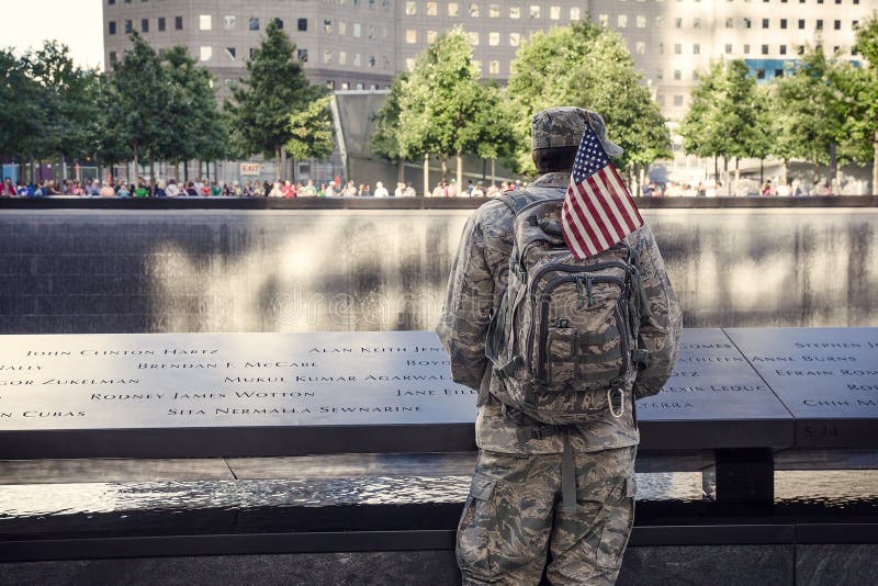 10th anniversary of 9/11 in New York City: Soldier is staying near Memorial at World Trade Center Ground Zero. 10th anniversary of 9/11 in New York City: Soldier is staying near Memorial at World Trade Center Ground Zero