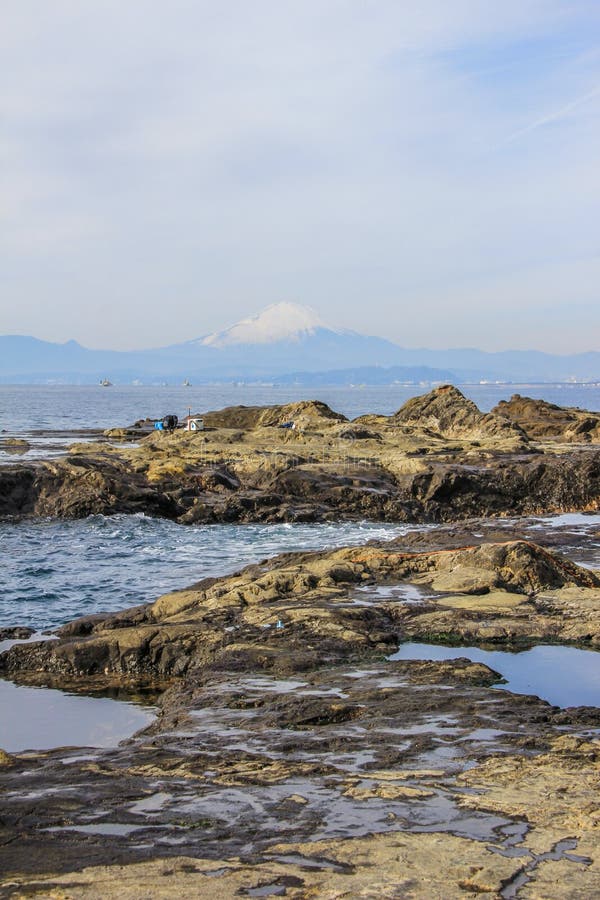 2013.01.06, Kamakura, Japan. Auto trip around famous places of Japan.fishermen on the rocks of Enoshima. 2013.01.06, Kamakura, Japan. Auto trip around famous places of Japan.fishermen on the rocks of Enoshima