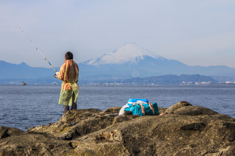 2013.01.06, Kamakura, Japan. Auto trip around famous places of Japan.fishermen on the rocks of Enoshima. 2013.01.06, Kamakura, Japan. Auto trip around famous places of Japan.fishermen on the rocks of Enoshima