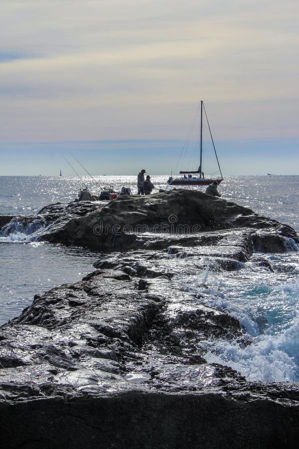 2013.01.06, Kamakura, Japan. Auto trip around famous places of Japan.fishermen on the rocks of Enoshima. 2013.01.06, Kamakura, Japan. Auto trip around famous places of Japan.fishermen on the rocks of Enoshima