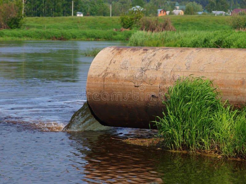 Pipe industrial wastewater pollutes river. Pipe industrial wastewater pollutes river