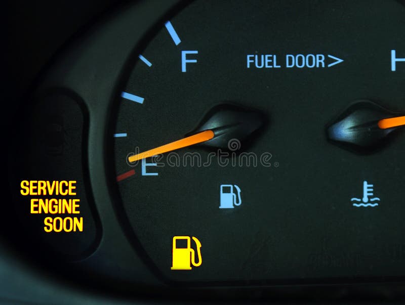 The service engine soon and gas light are lit up on a car. The service engine soon and gas light are lit up on a car.