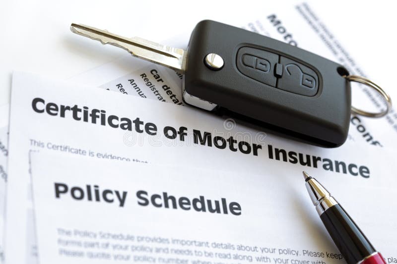 Certificate of motor insurance and policy schedule with car key. Certificate of motor insurance and policy schedule with car key
