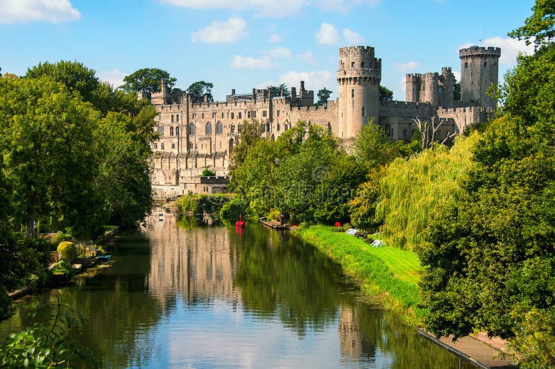 Warwick castle from outside. It is a medieval castle built in 11th century and a major touristic attraction in UK nowadays. Sunny day. Warwick castle from outside. It is a medieval castle built in 11th century and a major touristic attraction in UK nowadays. Sunny day