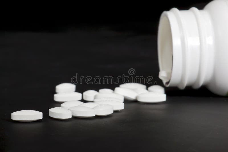 Medication pills isolated on a black background. Medication pills isolated on a black background