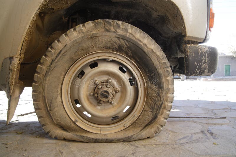 Flat tire on off-road vehicle in Bolivia. Flat tire on off-road vehicle in Bolivia