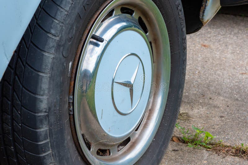 POTTERVILLE, MI - JUNE 23rd 2021: The front tire of a classic 1970 German car. High quality photo. POTTERVILLE, MI - JUNE 23rd 2021: The front tire of a classic 1970 German car. High quality photo