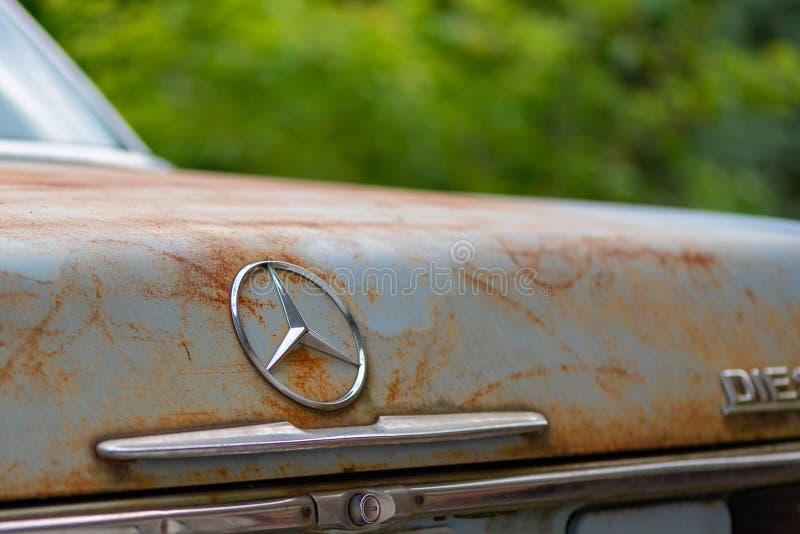 POTTERVILLE, MI - JUNE 23rd 2021: 1976 Rusty Mercedes Benz trunk. High quality photo. POTTERVILLE, MI - JUNE 23rd 2021: 1976 Rusty Mercedes Benz trunk. High quality photo