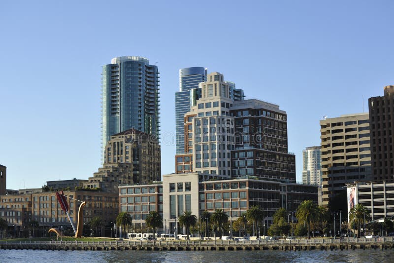 San Francisco skyline buildings; with peer and bay. Modern luxury office buildings clustered around peer. San Francisco skyline buildings; with peer and bay. Modern luxury office buildings clustered around peer.