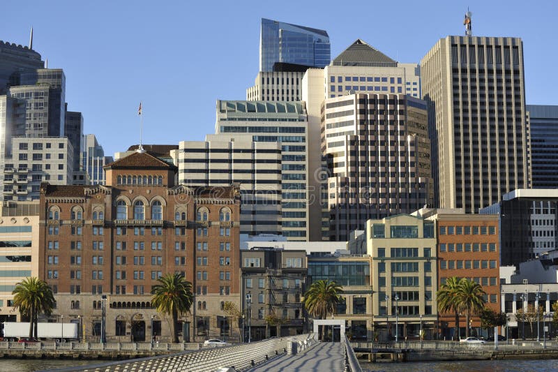 San Francisco skyline buildings; with peer and bay. Modern luxury office buildings clustered around peer. San Francisco skyline buildings; with peer and bay. Modern luxury office buildings clustered around peer.