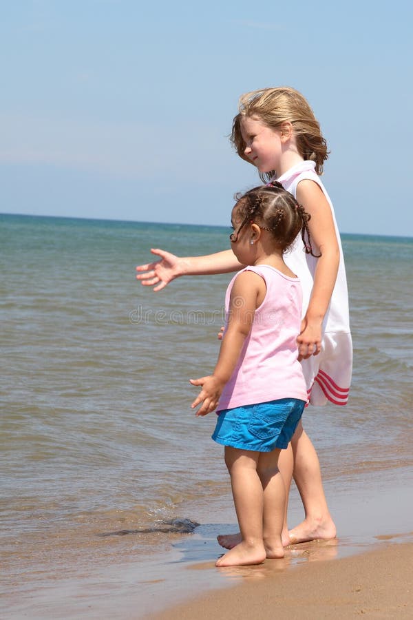 Two girls standing on the shore of Lake Michigan. Two girls standing on the shore of Lake Michigan