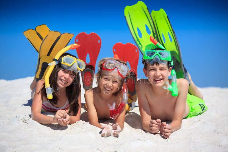 A group of happy kids on the beach. A group of happy kids on the beach.