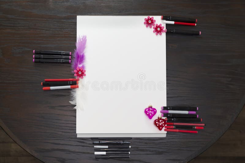 large block offers much space for your own designs. Mock Up. Photographed from above. Red and pink felt tip pens, feathers and glass hearts. large block offers much space for your own designs. Mock Up. Photographed from above. Red and pink felt tip pens, feathers and glass hearts