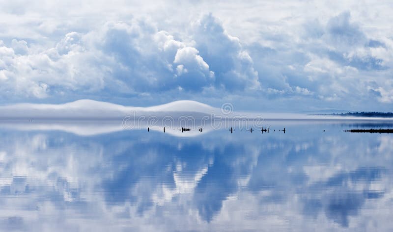 Cloudscape reflected in Siljan lake, Dalarna, Sweden. Cloudscape reflected in Siljan lake, Dalarna, Sweden.