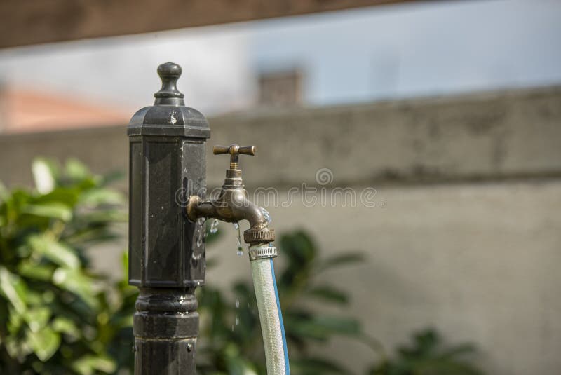 Leaking faucet detail symbol of waste water in domestic use. Leaking faucet detail symbol of waste water in domestic use