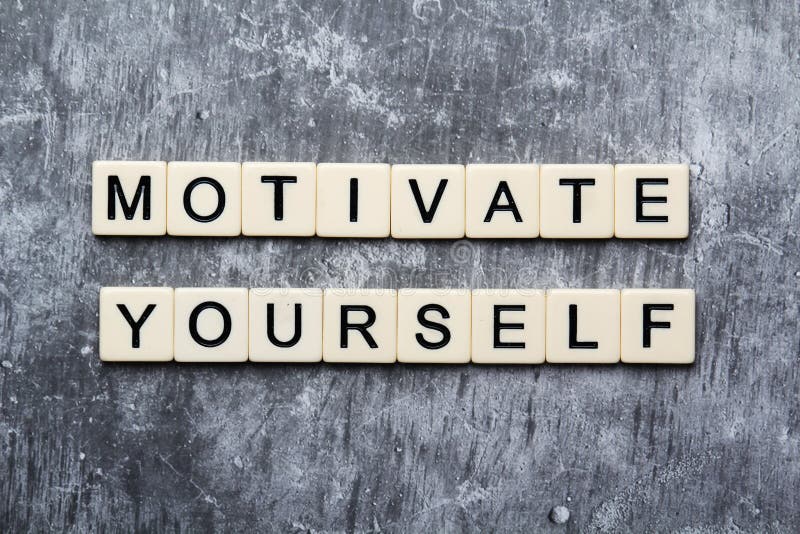 Motivational phrase Motivate yourself formed with plastic toy tiles. Motivational phrase Motivate yourself formed with plastic toy tiles