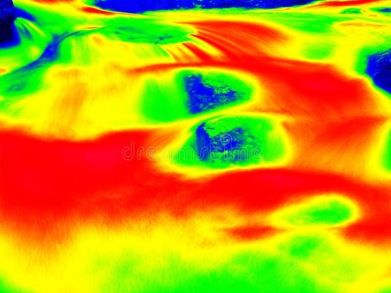 Foamy water level of waterfall, curves between boulders of rapids. Cold water of mountain river in infrared photo. Amazing thermography. Foamy water level of waterfall, curves between boulders of rapids. Cold water of mountain river in infrared photo. Amazing thermography.