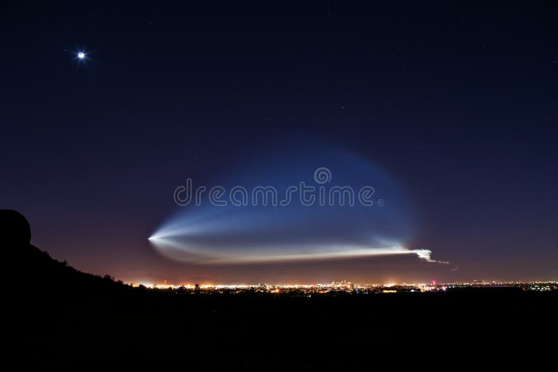 Rocket launch illuminated in the night sky over Phoenix, Arizona. Rocket launch illuminated in the night sky over Phoenix, Arizona.