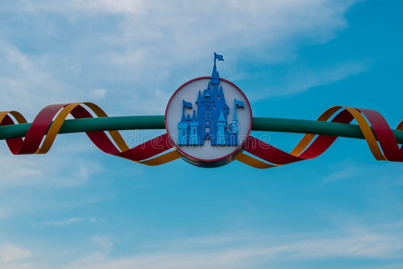 Orlando, Florida. April 23, 2019. Top view of Cinderella`s Castle sign on lightblue cloudy sky background  at Walt Disney World  area. Orlando, Florida. April 23, 2019. Top view of Cinderella`s Castle sign on lightblue cloudy sky background  at Walt Disney World  area.