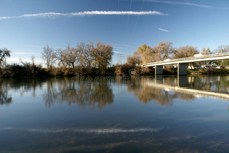 Beautiful lake in Ash Creek, California, USA, created by inflowing streams, clear waters famous for fishing, low Sun rays giving a charming view, attraction for hikers, hunters and camping sites. Beautiful lake in Ash Creek, California, USA, created by inflowing streams, clear waters famous for fishing, low Sun rays giving a charming view, attraction for hikers, hunters and camping sites.