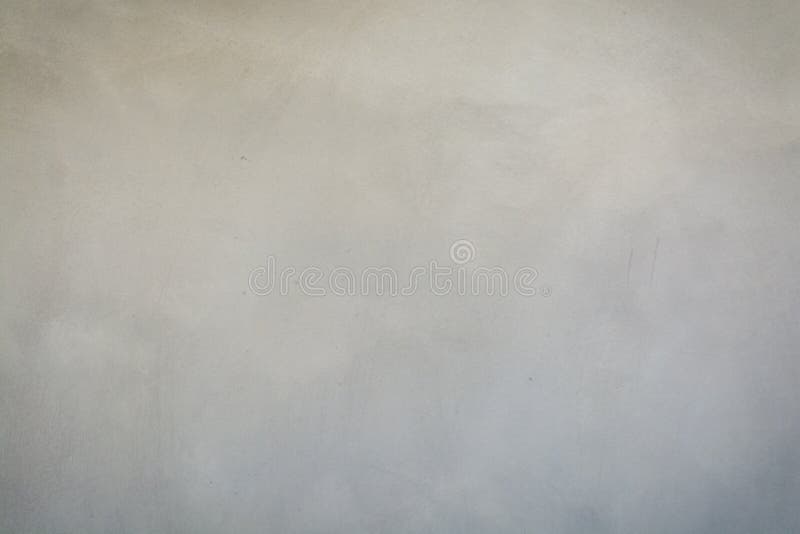 灰色或黑暗的波兰水泥墙壁抽象迷离Defocus背景有剧烈的照明设备的