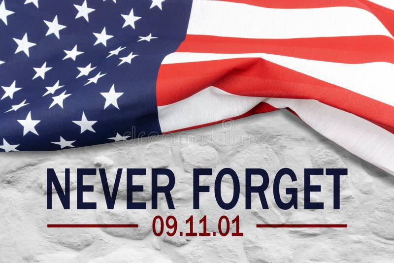 9/11 Patriot Day, September 11. `Never Forget`, Text and USA flag on white wall. 9/11 Patriot Day, September 11. `Never Forget`, Text and USA flag on white wall