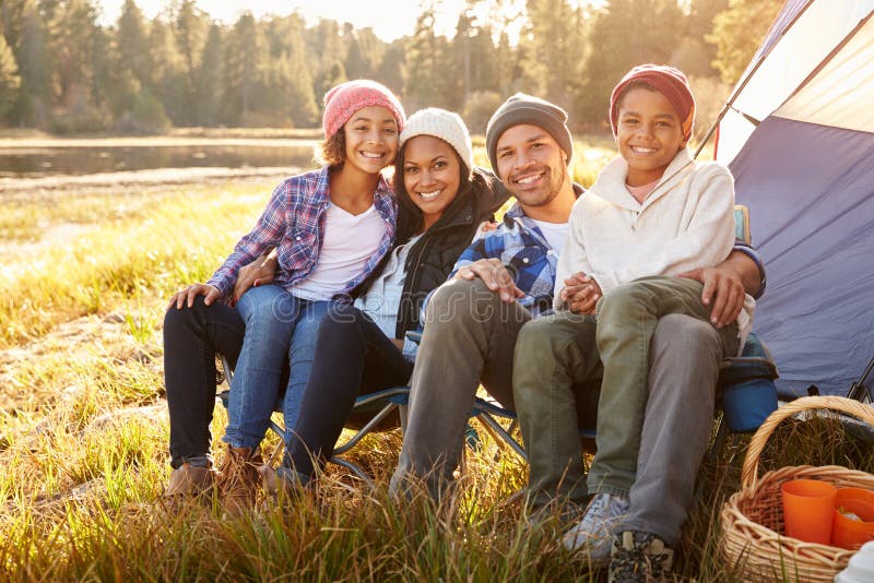 Portrait Of Parents With Children Camping By Lake. Portrait Of Parents With Children Camping By Lake