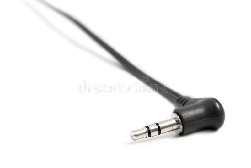 Closeup of a 3.5mm stereo audio phone connector plug isolated on white background. Closeup of a 3.5mm stereo audio phone connector plug isolated on white background