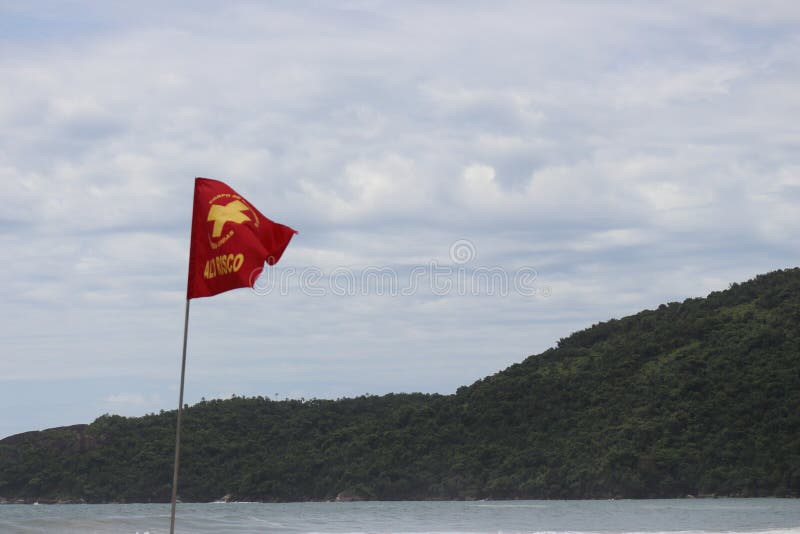 Trindade, Paraty/Rio de Janeiro/Brazil - 01-19-2020: Praia do Meio beach. Strong waves, dangerous sea, drowning risk, sorrounded by many rocks. Trindade, Paraty/Rio de Janeiro/Brazil - 01-19-2020: Praia do Meio beach. Strong waves, dangerous sea, drowning risk, sorrounded by many rocks