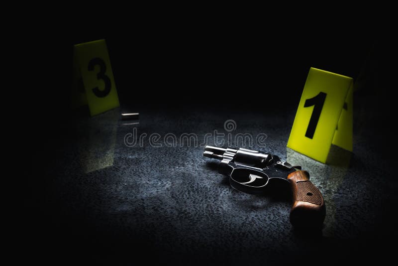 Crime scene concept with a gun and evidence markers, high contrast image. Crime scene concept with a gun and evidence markers, high contrast image