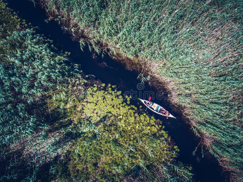 Exploring Danube Delta with a Canoe aerial view. Exploring Danube Delta with a Canoe aerial view