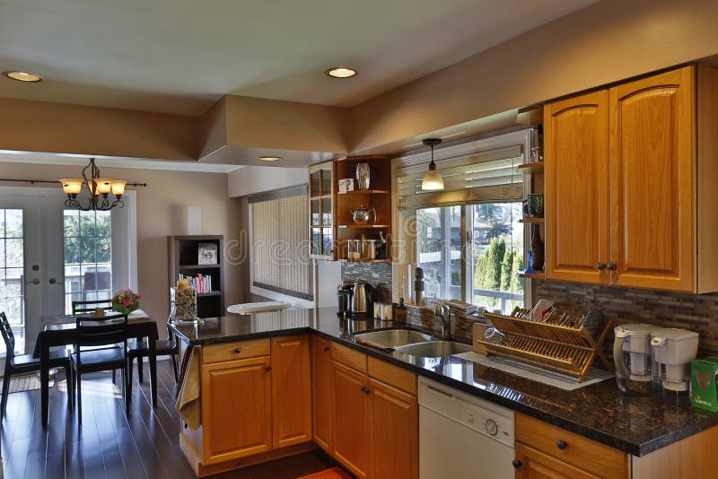 British Columbia, Canada - April 2, 2016: Interior of a modern kitchen home renovation and cabinets with appliances. British Columbia, Canada - April 2, 2016: Interior of a modern kitchen home renovation and cabinets with appliances