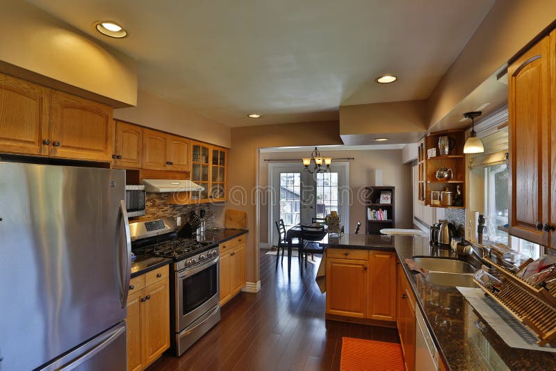 British Columbia, Canada - April 2, 2016: Interior of a modern kitchen home renovation and cabinets with appliances. British Columbia, Canada - April 2, 2016: Interior of a modern kitchen home renovation and cabinets with appliances