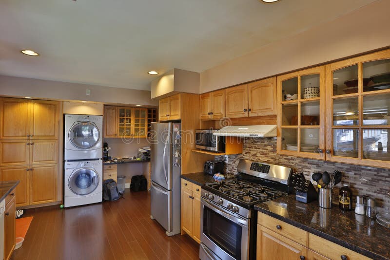 British Columbia, Canada - April 2, 2016: Interior of a modern kitchen home renovation and cabinets with appliances. British Columbia, Canada - April 2, 2016: Interior of a modern kitchen home renovation and cabinets with appliances