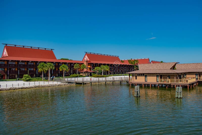 Orlando, Florida. May 16, 2019. Polynesian Resort cabins and Disney`s Grand Floridian Resort & Spa on sunset background at Walt Disney World  1. Orlando, Florida. May 16, 2019. Polynesian Resort cabins and Disney`s Grand Floridian Resort & Spa on sunset background at Walt Disney World  1