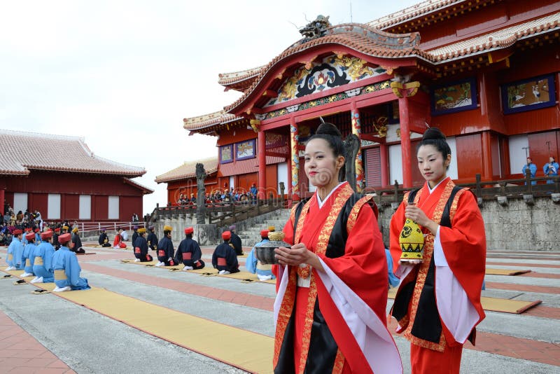 The women carry the bottle of sake in the ancient new year ceremony reenacted at Shuri castle on January 1 in Okinawa, Japan. The women carry the bottle of sake in the ancient new year ceremony reenacted at Shuri castle on January 1 in Okinawa, Japan.