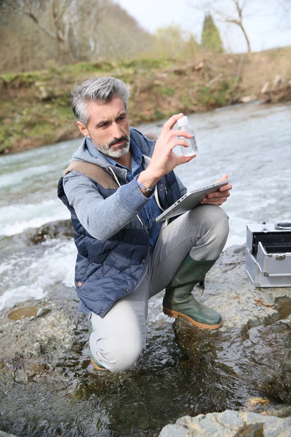 Biologist testing quality of natural water. Biologist testing quality of natural water
