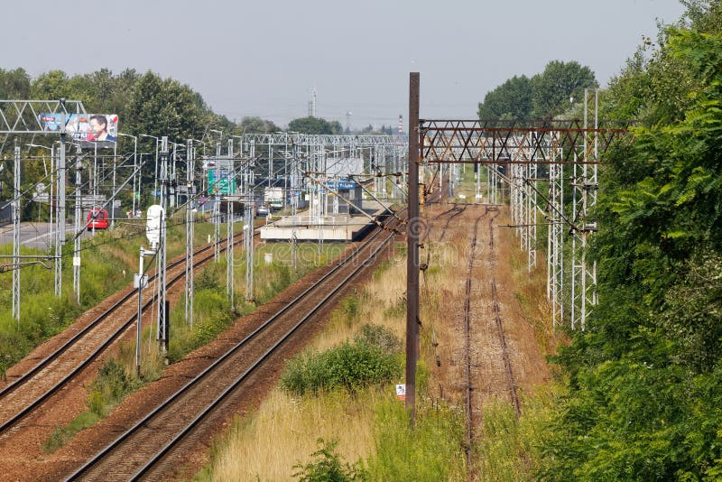 Electrified two-track railway line cutting through the industrial section of the town, Katowice Zaleze station. Electrified two-track railway line cutting through the industrial section of the town, Katowice Zaleze station..