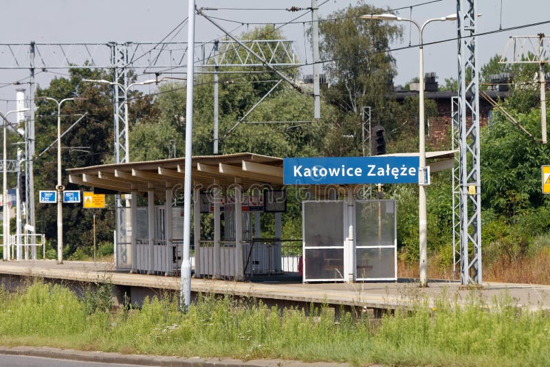 Electrified two-track railway line cutting through the industrial section of the town, Katowice Zaleze station. Electrified two-track railway line cutting through the industrial section of the town, Katowice Zaleze station.