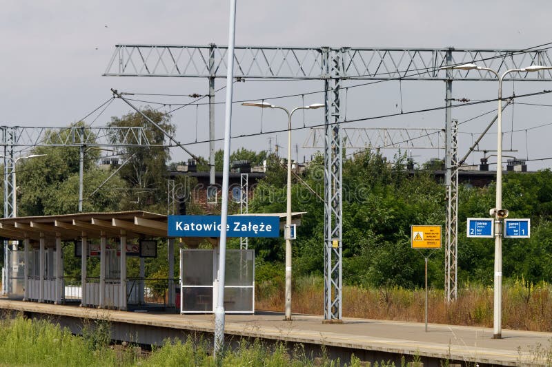 Electrified two-track railway line cutting through the industrial section of the town, Katowice Zaleze station. Electrified two-track railway line cutting through the industrial section of the town, Katowice Zaleze station.