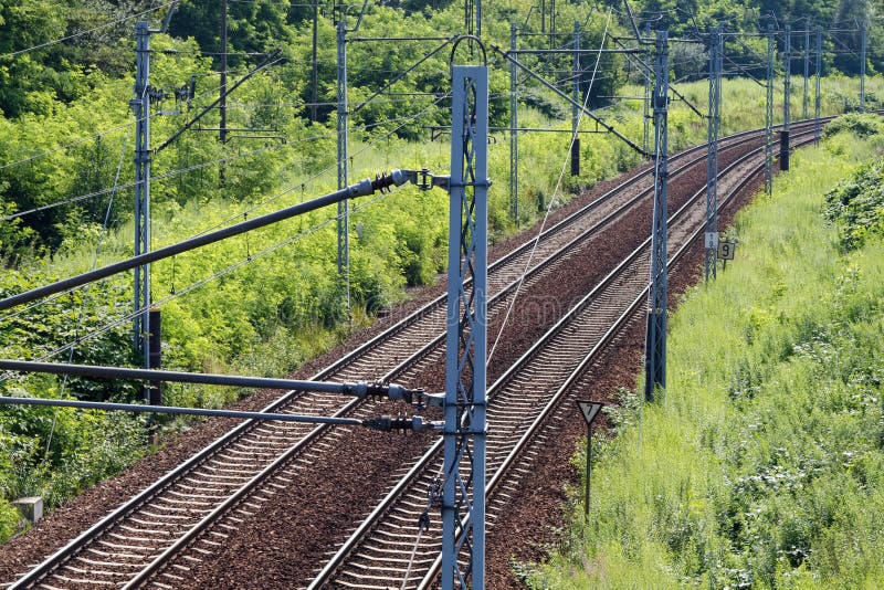 Electrified two-track railway line cutting through the industrial section of the town. Electrified two-track railway line cutting through the industrial section of the town.