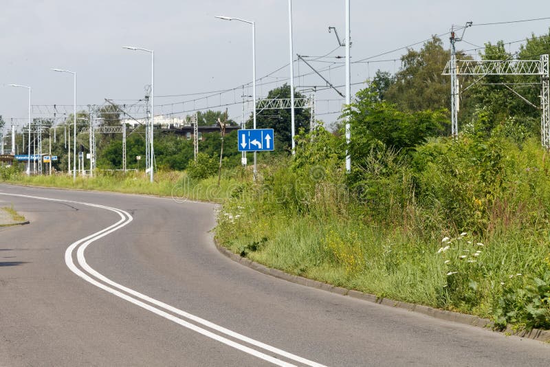 Electrified two-track railway line cutting through the industrial section of the town. Electrified two-track railway line cutting through the industrial section of the town.