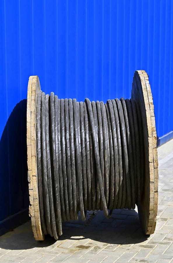 Wooden coil of electric cable on construction site. Wooden coil of electric cable on construction site