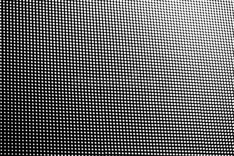 White dot pattern fade size gradient row on black background. White dot pattern fade size gradient row on black background.